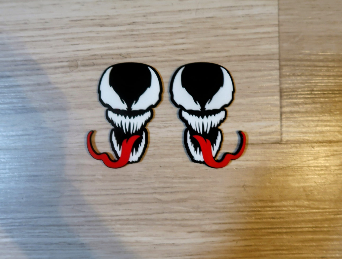 Venom with Tongue badges. Includes 2