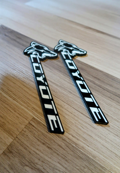 Coyote badges. Includes 2.