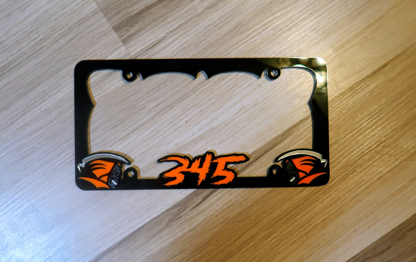 Grim Reaper custom license plate frame.