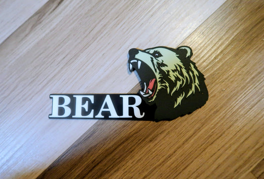 Grizzly Bear badges. Includes 1