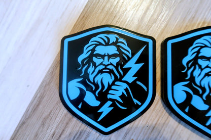 Zeus badges. Includes 2