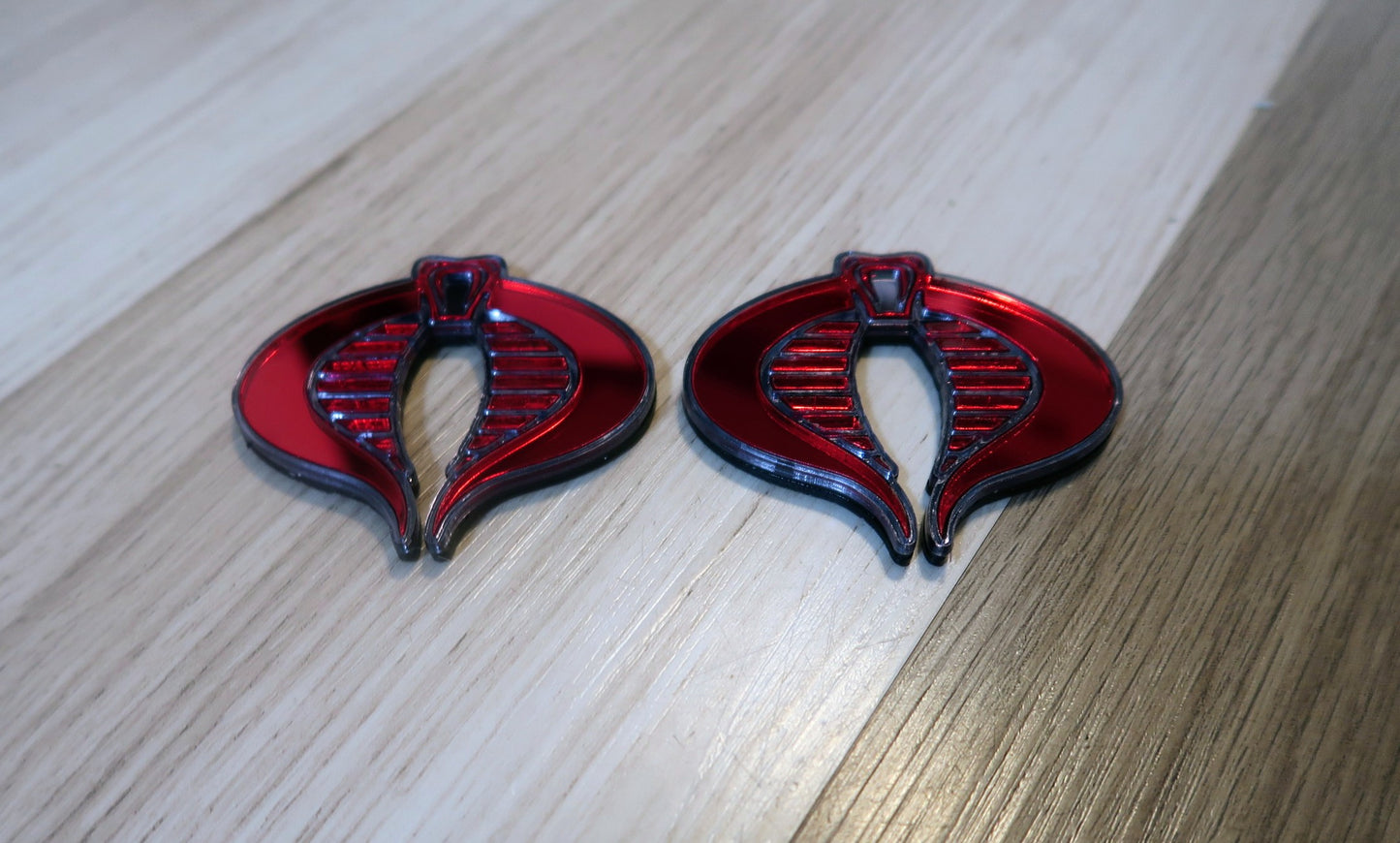 G.I. Joe Cobra badges. Includes 2