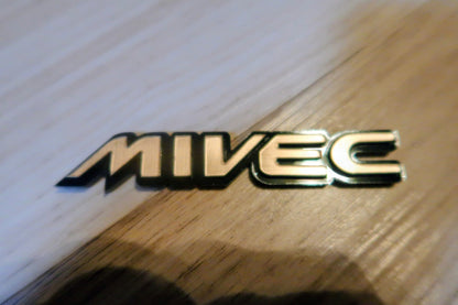 Mivec badge. Includes 1