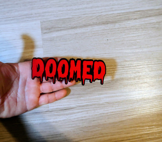 DOOMED Badge. Includes 1
