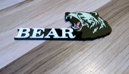 Grizzly Bear badges. Includes 1