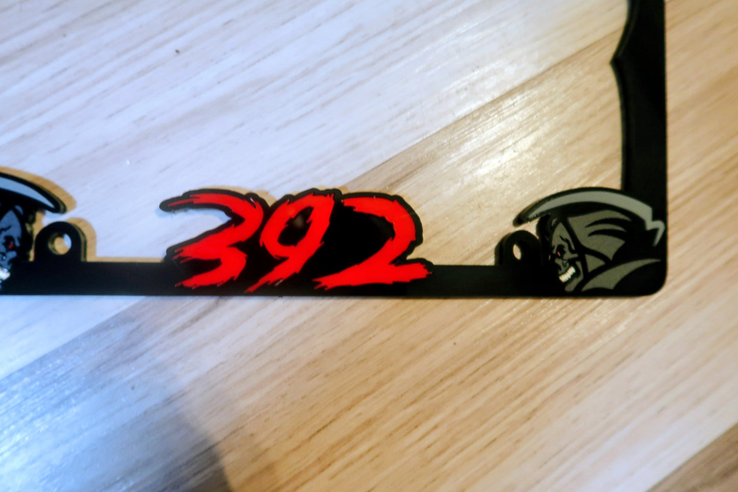 Grim Reaper custom license plate frame.