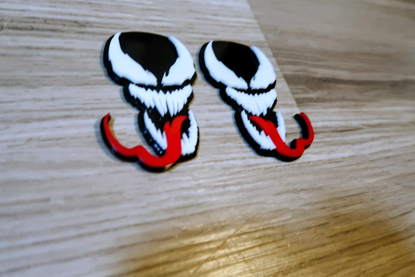 Venom with Tongue badges. Includes 2