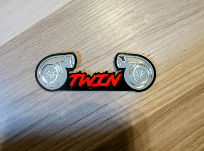 Twin Turbo badge. Includes 1.