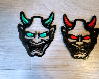 Oni Mask Badge. Includes 2
