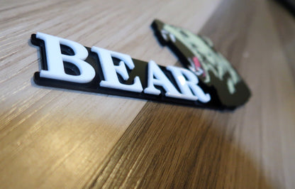 Grizzly Bear badges. Includes 1