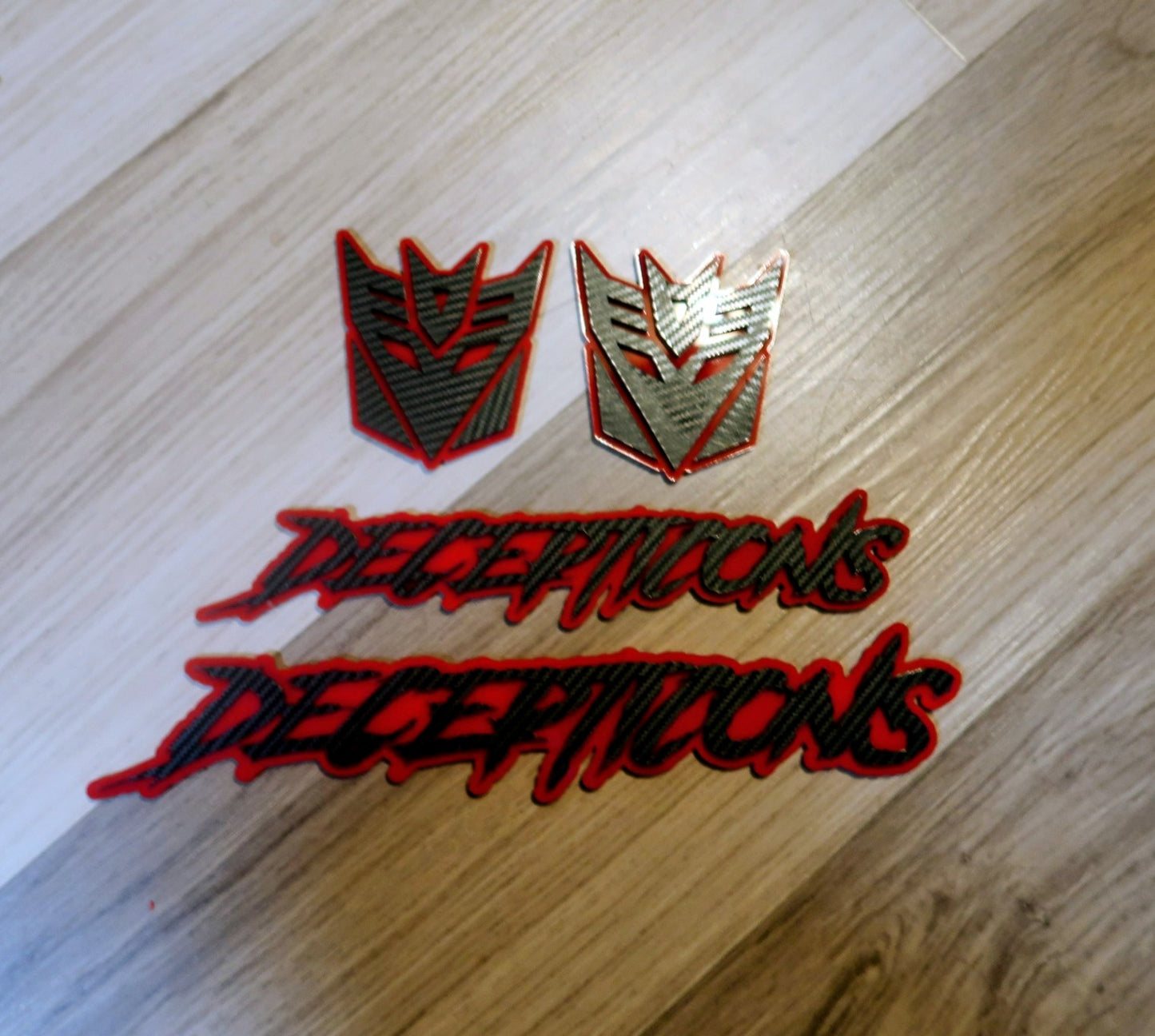 Decepticons text badge. Includes 1.