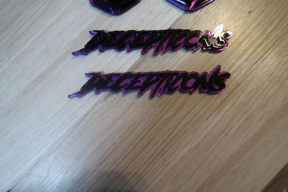Decepticons text badge. Includes 1.