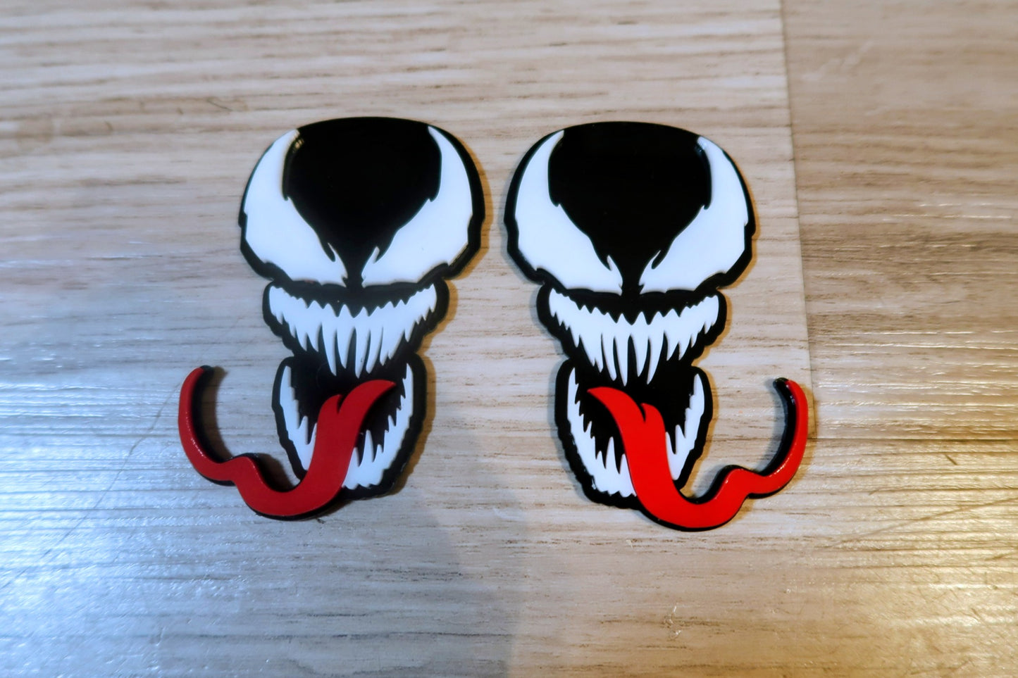 Venom with Tongue badges. Includes 2