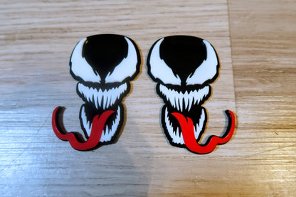 Venom with Tongue badges. Includes 2