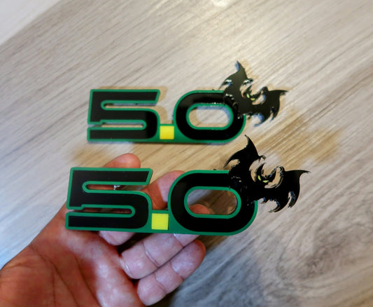 5.0 Bat badges. Includes 2.