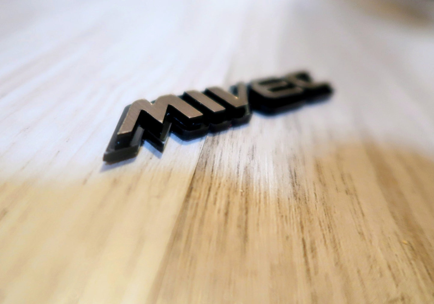 Mivec badge. Includes 1