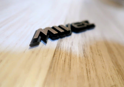 Mivec badge. Includes 1