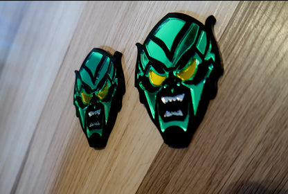 Inspired Green Goblin badges. Includes 2.
