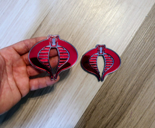 G.I. Joe Cobra badges. Includes 2