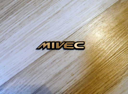 Mivec badge. Includes 1
