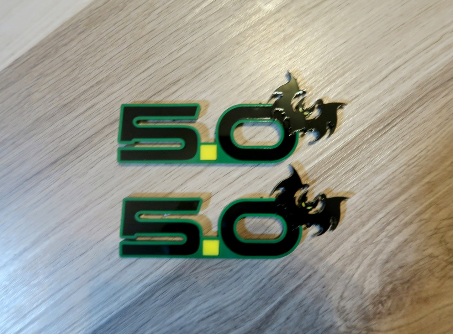 5.0 Bat badges. Includes 2.