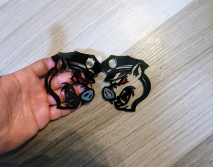 Pig fender badges. Includes 2