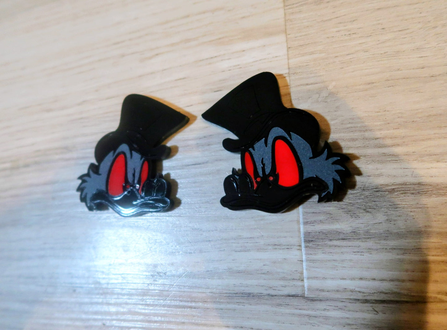 Evil Scrooge fender badges. Includes 2