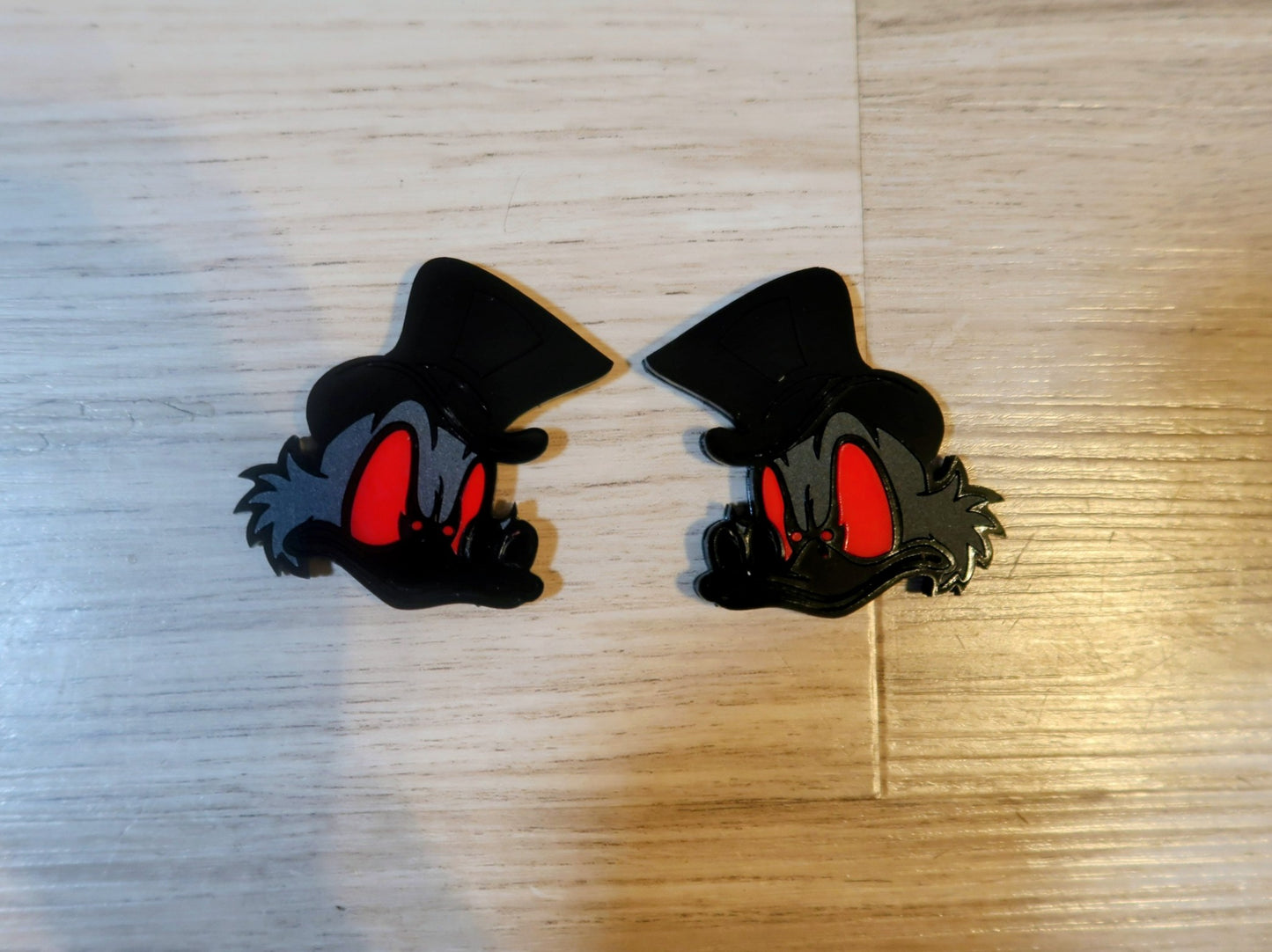 Evil Scrooge fender badges. Includes 2
